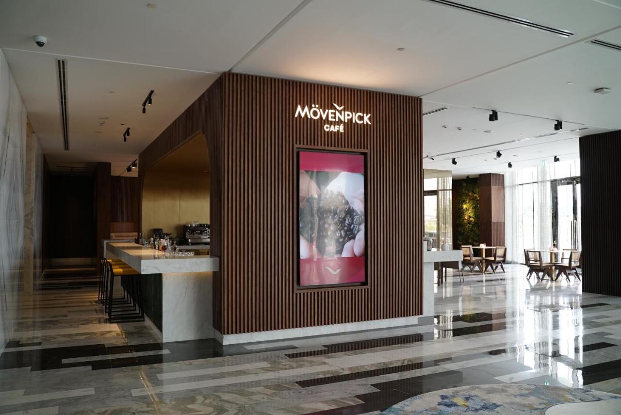 Movenpick Jumeirah Village Triangle Dubaï Extérieur photo Mövenpick Café in the lobby of the Kempinski Hotel, Amman, Jordan