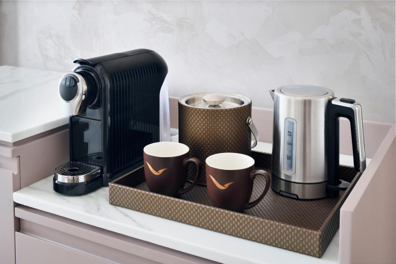 Movenpick Jumeirah Village Triangle Dubaï Extérieur photo A Nespresso coffee machine